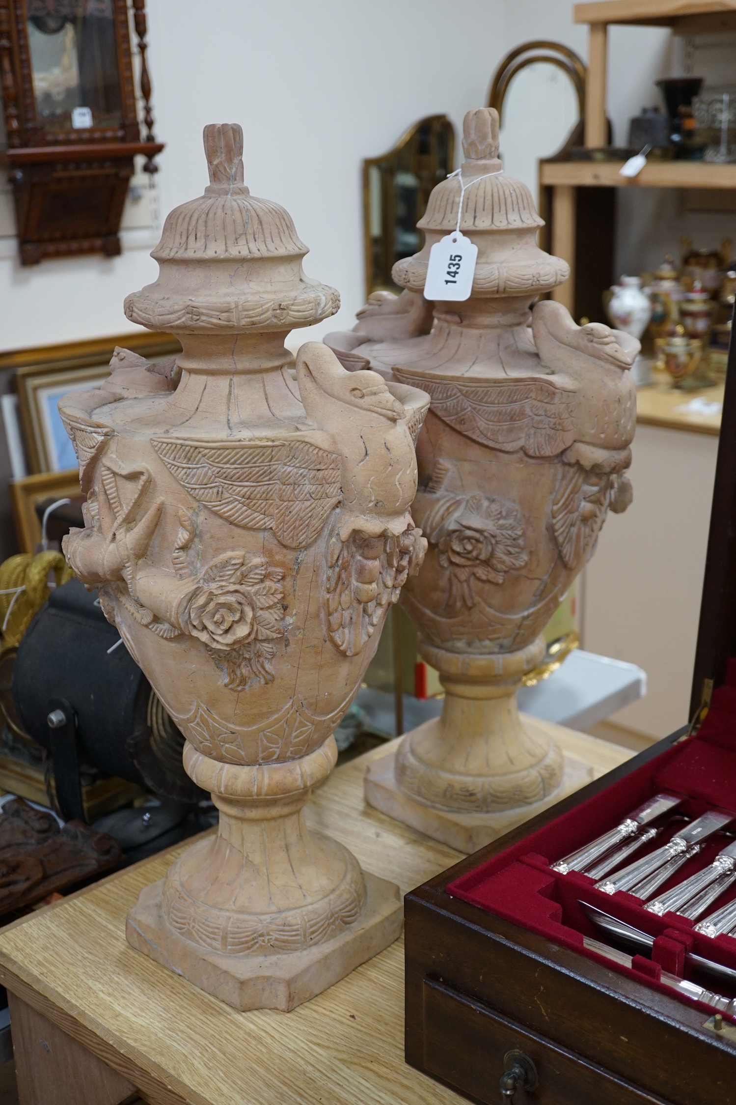 A large pair of Italian carved hardstone finial urns, 59cm